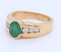Incredible Yellow Gold oval Cut Emerald and Diamond Ring