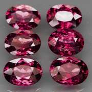 Amazing 9.27ct oval cut violet red Garnet set