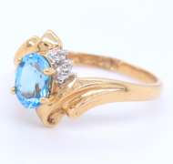 Fantastic Yellow Gold Blue Topaz and Diamond Ring