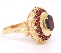 Powerful Yellow Gold oval Garent and Halo Garnet Ring