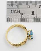 Feminine Filigree Blue Topaz Ring