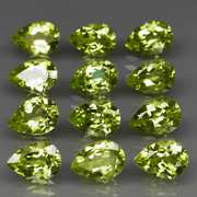 Dazzling 8.66ct untreated apple green Peridot set