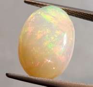 Full cover! 8.08ct rolling floral flashing Welo Opal