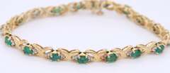 Handsome Yellow Gold Emerald and Diamond Tennis Bracelet