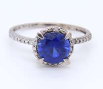 Attractive White Gold Round Blue Stone and Diamond Halo Ring