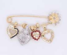 Attractive Yellow Gold Safety Pin with 4 Charms