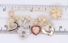 Attractive Yellow Gold Safety Pin with 4 Charms