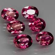 Amazing 9.27ct oval cut violet red Garnet set