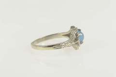 14K White Gold Oval Syn. Star Sapphire Vine Leaf Bypass Ring