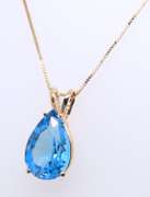 Set of Pear Shaped Topaz Pendant on Chain and Earrings in Yellow Gold