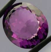 Substantial oval cut 21.43ct violet Amethyst