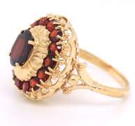 Powerful Yellow Gold oval Garent and Halo Garnet Ring
