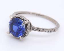Attractive White Gold Round Blue Stone and Diamond Halo Ring