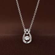 Pear shape With heart on top silver dancing pendant
