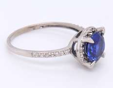 Attractive White Gold Round Blue Stone and Diamond Halo Ring