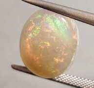 Full cover! 8.08ct rolling floral flashing Welo Opal