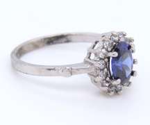 Charming White Gold Tanzanite and Diamond Halo Ring