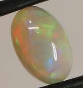 Full body flashing 1.86ct smoldering block and chaff Opal