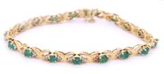 Handsome Yellow Gold Emerald and Diamond Tennis Bracelet
