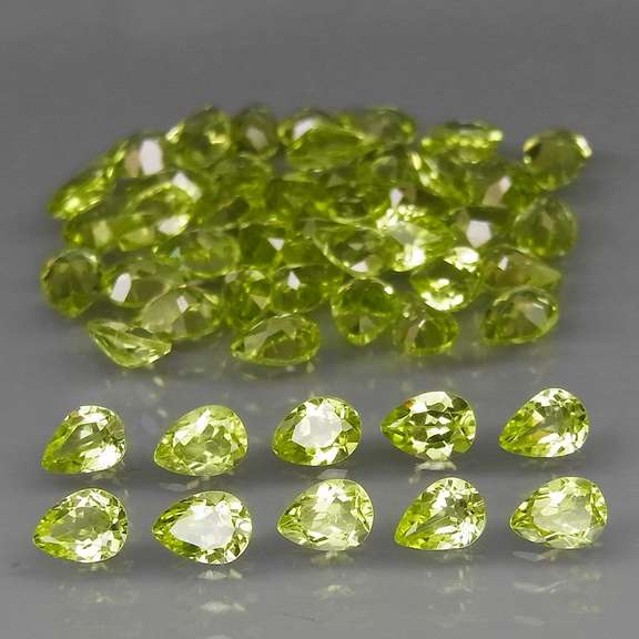 Dazzling 8.20ct untreated apple green Peridot set