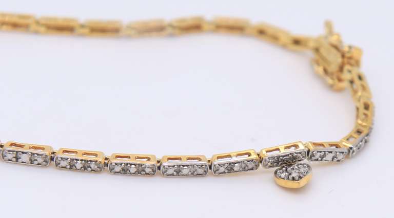 Sterling Silver Cubic Zirconia Bracelet with Tiny Heart Shaped Charm