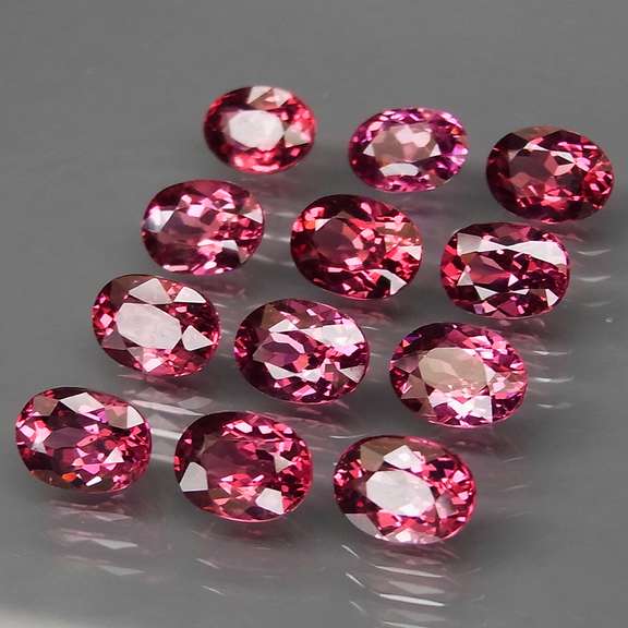 Ravishing 12.77ct violet pink Rhodolite Garnet set