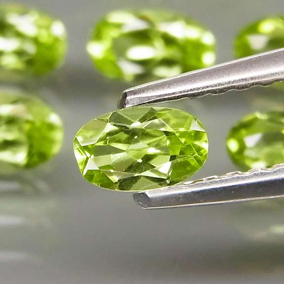 Dazzling 8.55ct untreated apple green Peridot set
