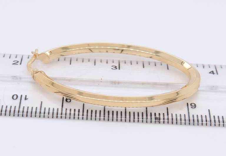Beautiful Yellow Gold oval  Hoop Earrings