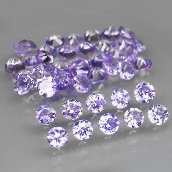 Heavy flashing 4.81ct diamond cut Tanzanite set