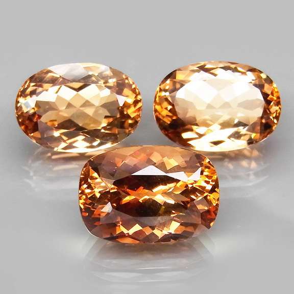 Matched! 3 piece 23.76ct full fire Imperial Topaz set