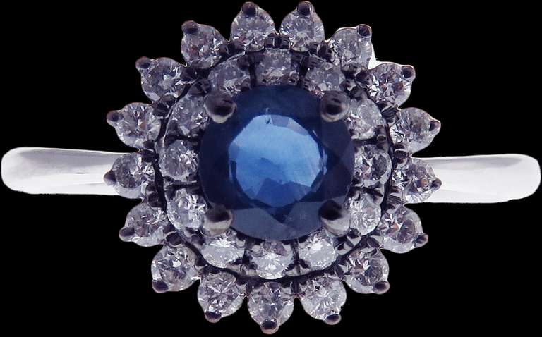 18k White Gold Sapphire Halo Ring surrounded with Diamonds