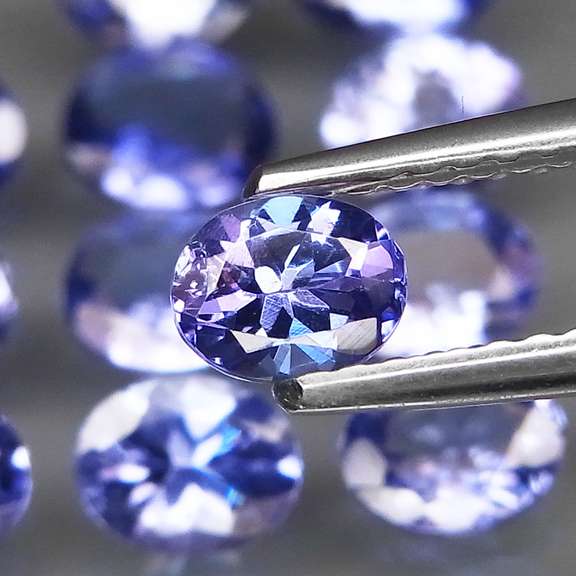 Heavy flashing 4.10ct oval cut Tanzanite set