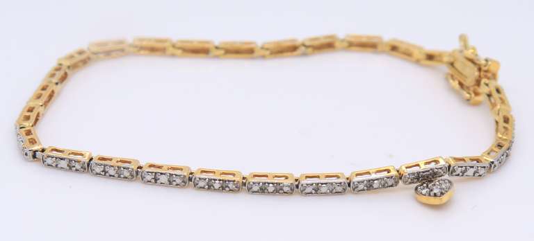Sterling Silver Cubic Zirconia Bracelet with Tiny Heart Shaped Charm