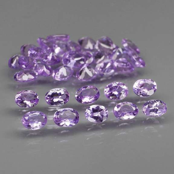 Heavy flashing 5.47ct oval cut Tanzanite set