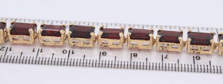 Majestic Yellow Gold Garnet Emerald Cut Bracelet