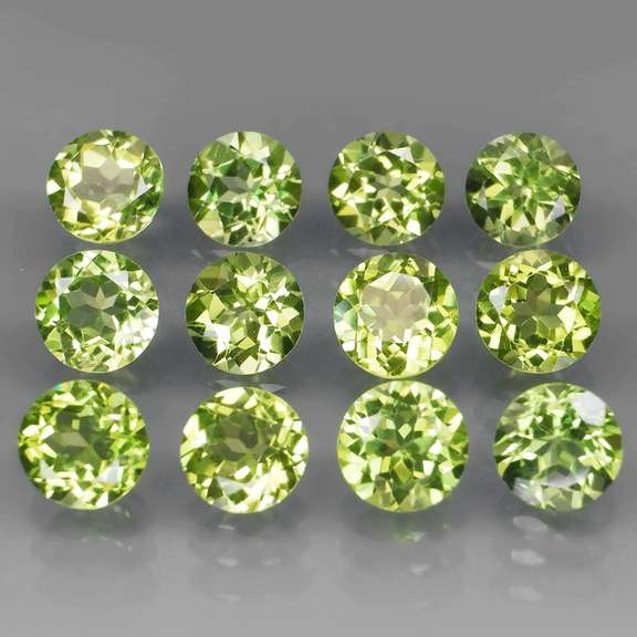 High grade 6.68ct untreated apple green Peridot set