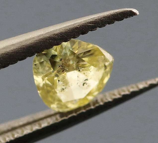 Amazing .28ct pear cut sultry yellow Diamond