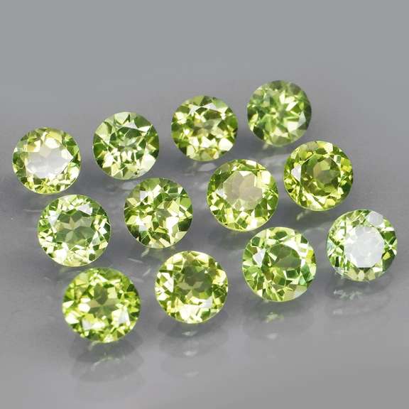 High grade 6.68ct untreated apple green Peridot set