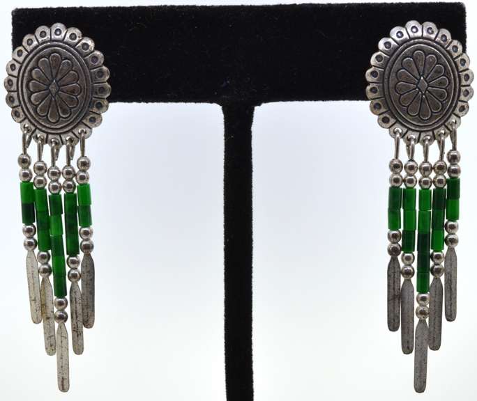 Silver Earrings With Green Beads Dangling From Them