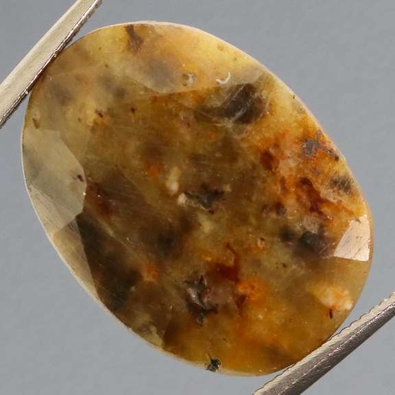 Super unique calico 13.44ct faceted Sapphire