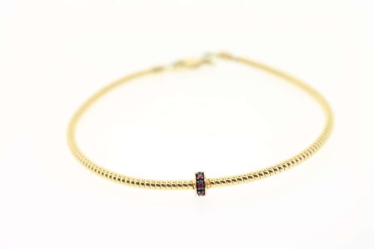 Ruby Round Center Feature 18KT Gold Wrap Bracelet