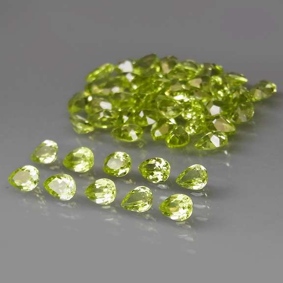 Dazzling 8.20ct untreated apple green Peridot set
