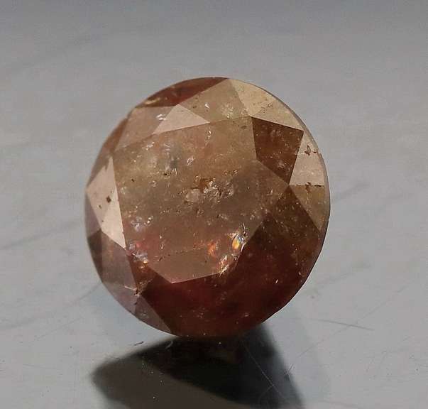 Eye catching 1.25ct round cut earth tones Diamond solitaire