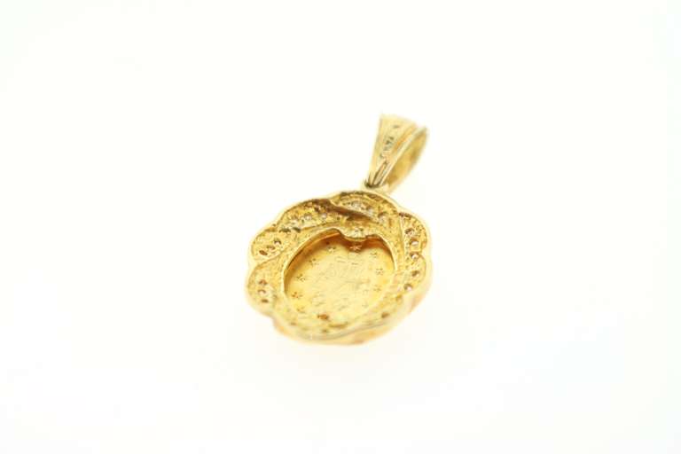 Radiant 18kt Gold Diamond Religious Pendant
