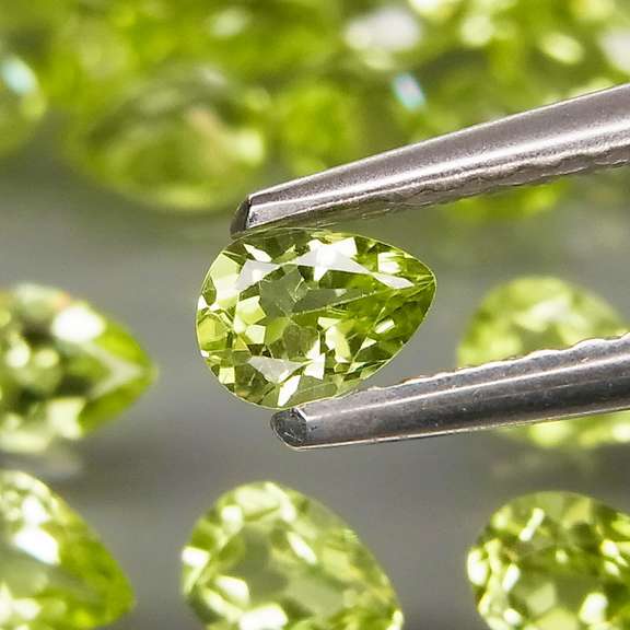 Dazzling 8.20ct untreated apple green Peridot set