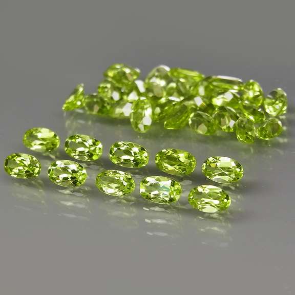 Dazzling 8.55ct untreated apple green Peridot set