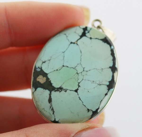 Striking well marbled 52.84ct Turquoise cabochon sterling pendant