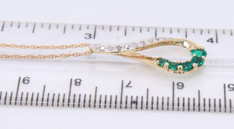 Stunning Yellow Gold Synthetic Emerald and Diamond Infinity Pendant on Chain