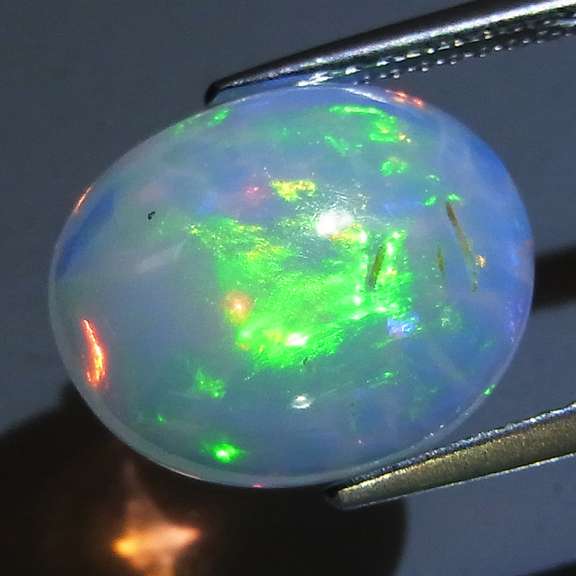 Remarkable 3.74ct rolling floral pattern Opal