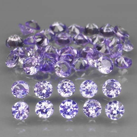Heavy flashing 4.81ct diamond cut Tanzanite set